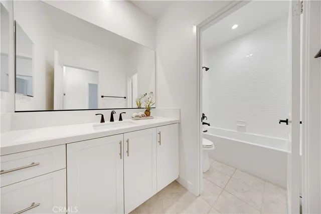 a bathroom with a bathtub and a sink