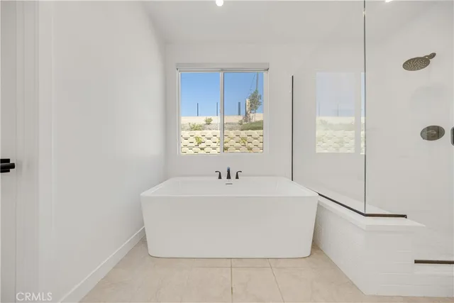 a white bath tub sitting in a bathroom