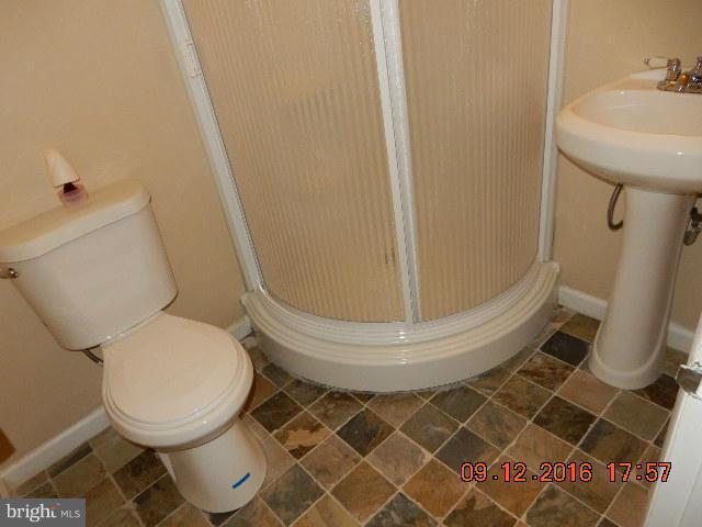 3907 Chaffey Road Randallstown, MD 21133 - Photo 12 of 17 a bathroom with a toilet and a sink