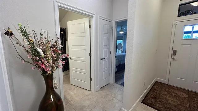 a bed sitting in a bedroom next to a window