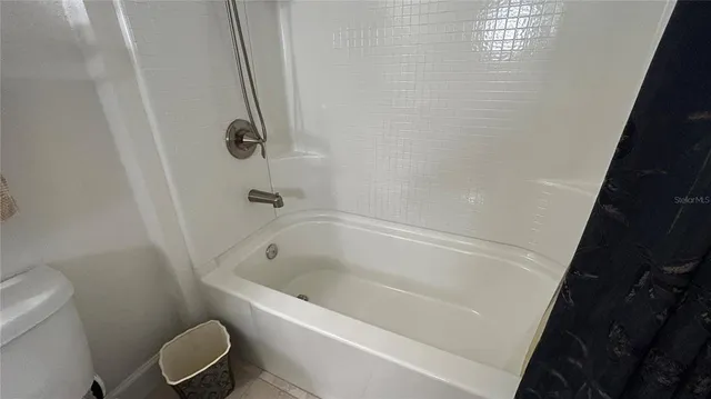 a view of a dining room with furniture window and flowerpot