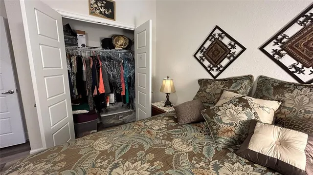 a bedroom with furniture and a chandelier