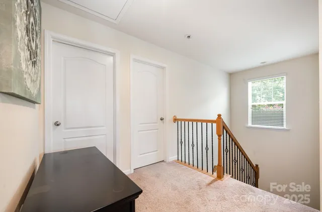 a bed sitting in a room next to a window
