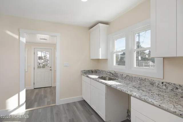 a kitchen with a sink stove and refrigerator