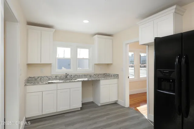 a view of a elevator with wooden floor