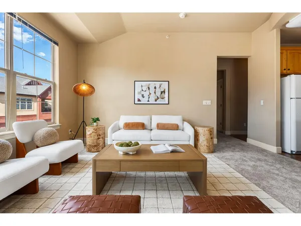 a living room with furniture and a table