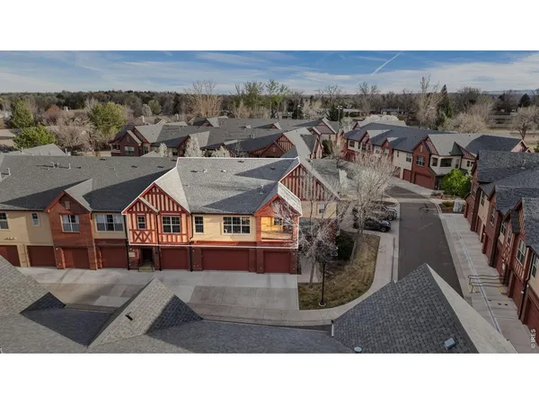 a aerial view of a house with a yard