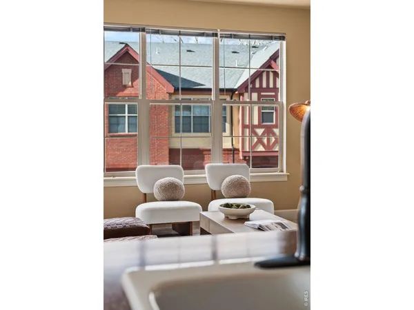 a view of a house with couches and chandelier