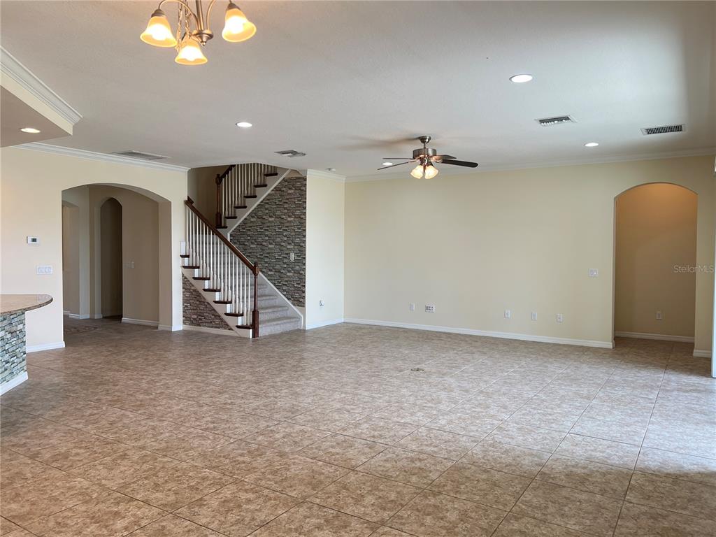 5753 Hydrangea Circle Sarasota, FL 34238 - Photo 9 of 31 an empty room with windows and stairs