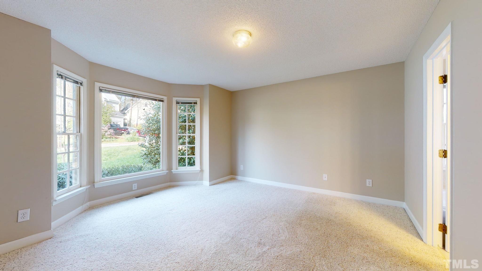 213 Silvercliff Trail Cary, NC 27513 - Photo 11 of 31 a view of an empty room with glass door