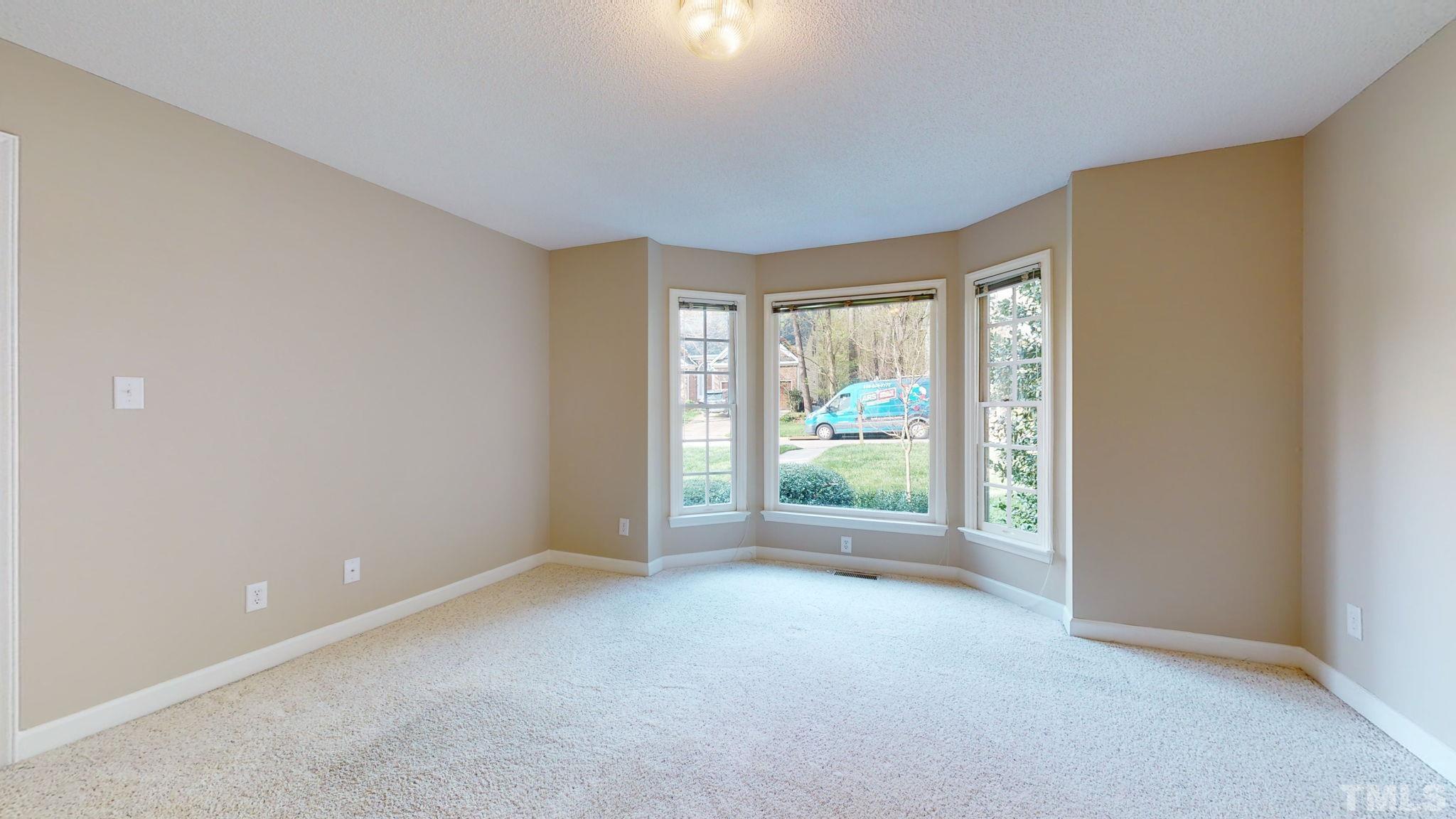 213 Silvercliff Trail Cary, NC 27513 - Photo 12 of 31 wooden floor in an empty room with a window