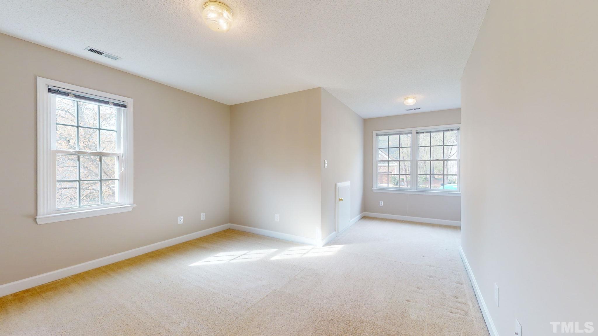 213 Silvercliff Trail Cary, NC 27513 - Photo 15 of 31 an empty room with windows and closet