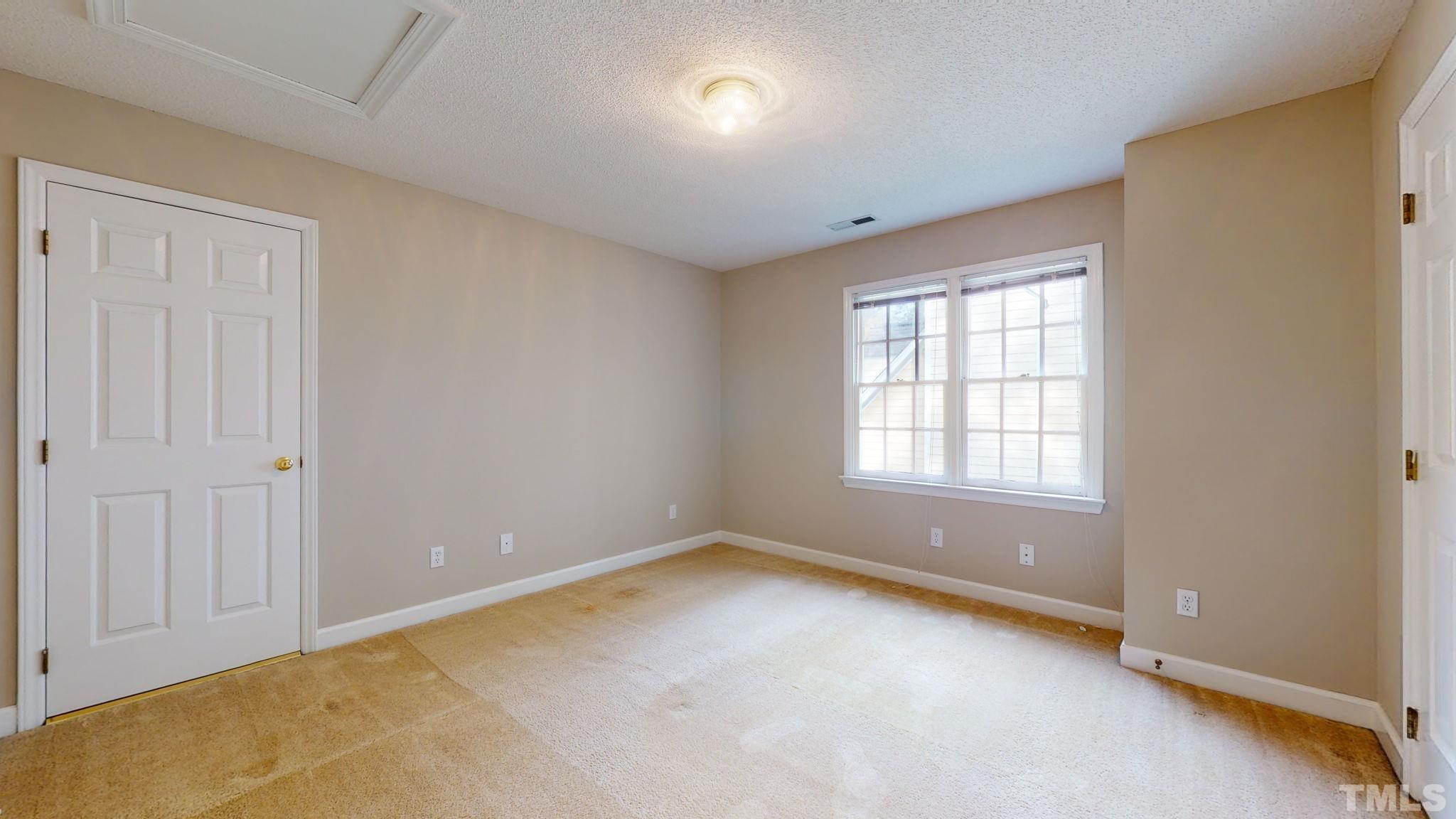 213 Silvercliff Trail Cary, NC 27513 - Photo 18 of 31 an empty room with a window