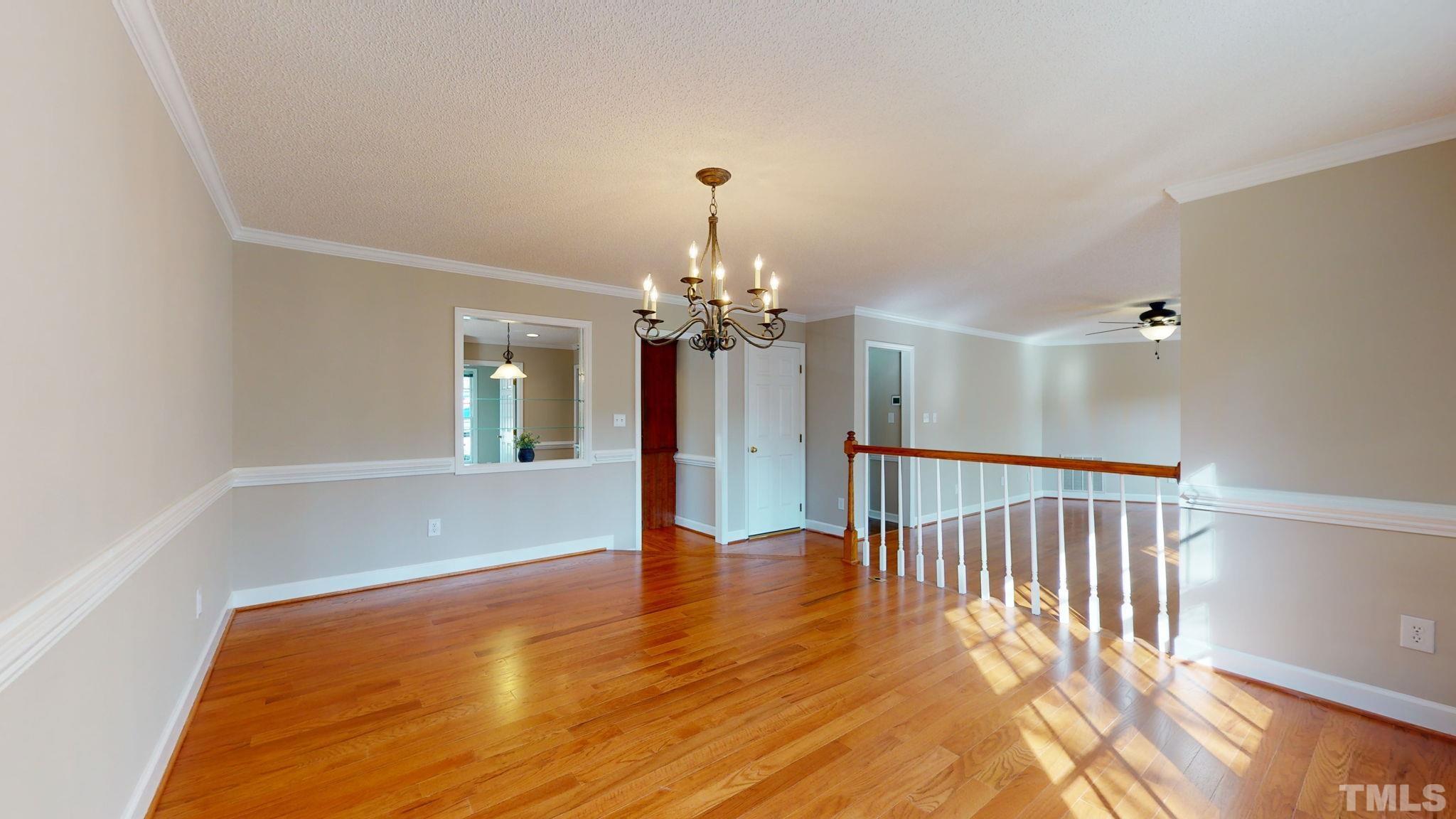 213 Silvercliff Trail Cary, NC 27513 - Photo 6 of 31 a view of entryway with wooden floor