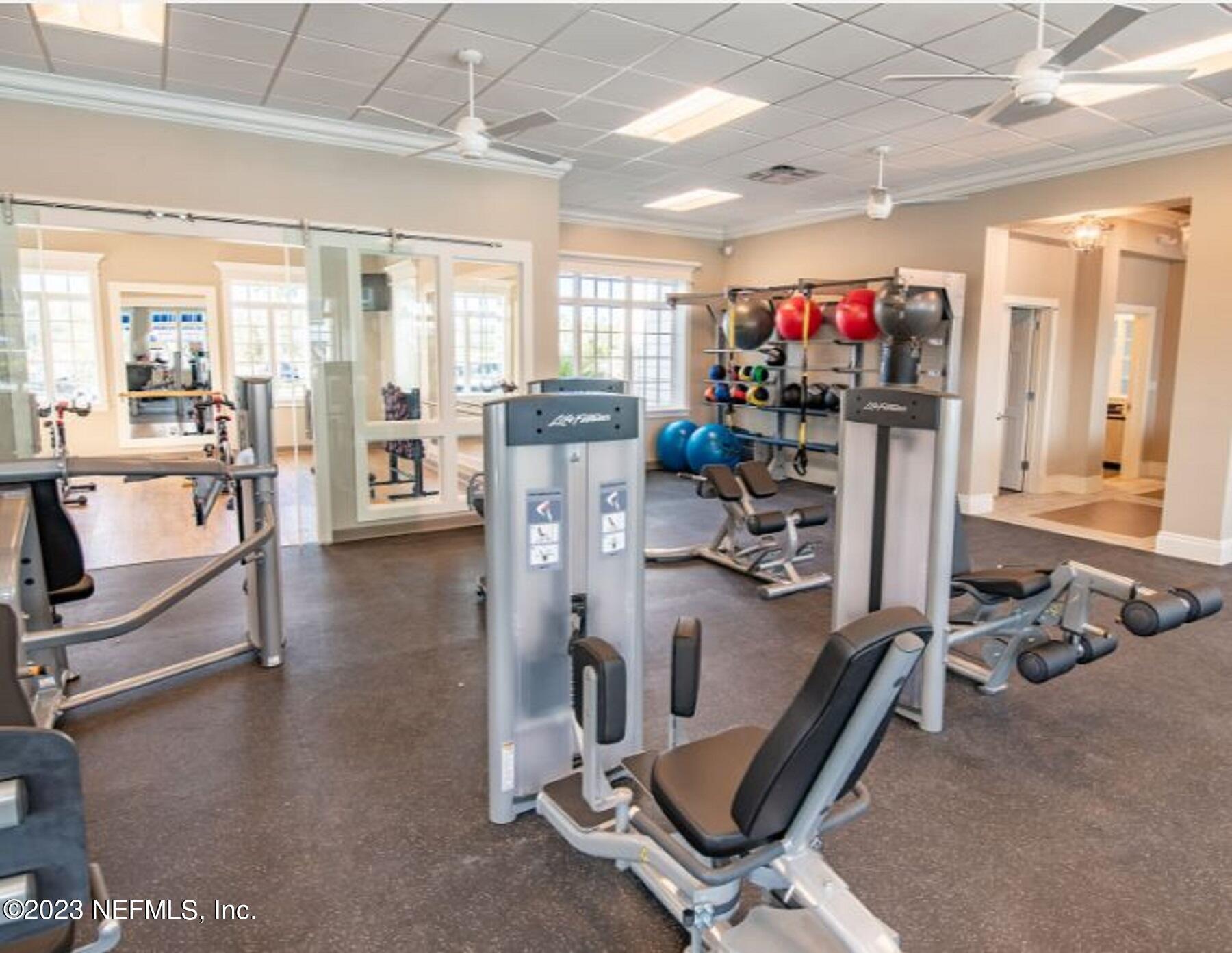346 Whirlwind Place, Unit 186 St. Augustine, FL 32095 - Photo 11 of 13 a view of a room with gym equipment