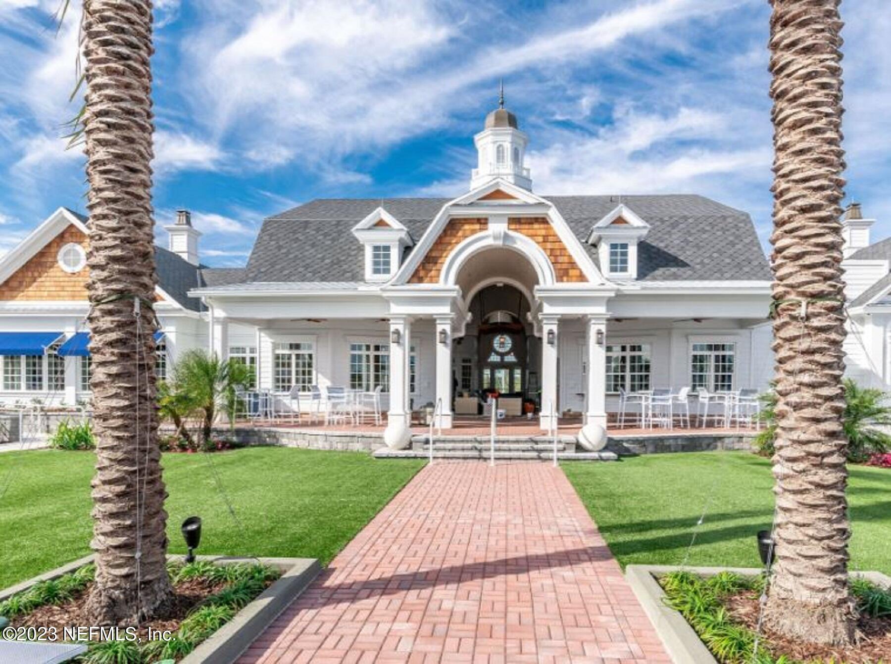 346 Whirlwind Place, Unit 186 St. Augustine, FL 32095 - Photo 4 of 13 a front view of a house with a yard