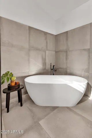 a white bath tub sitting in a bathroom