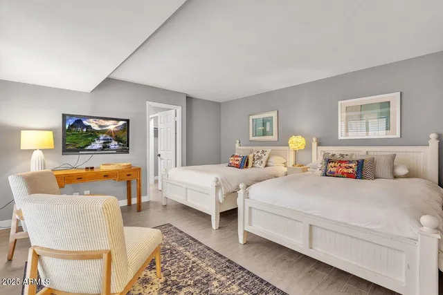 a bedroom with a bed and a couch