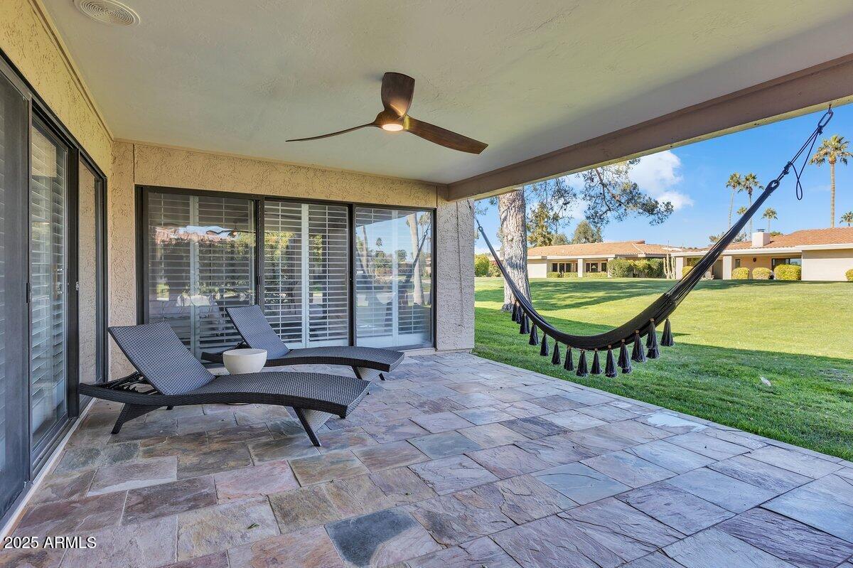 7614 East Gila Bend Road Scottsdale, AZ 85258 - Photo 28 of 36 a view of a swimming pool with lounge chair in front of city