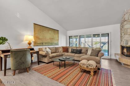 7614 East Gila Bend Road Scottsdale, AZ 85258 - Photo 4 of 36 a living room with furniture and a wooden floor