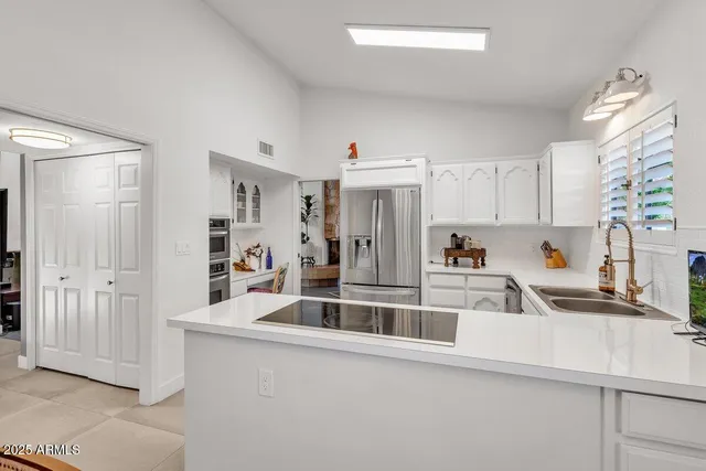 a view of a kitchen with a sink