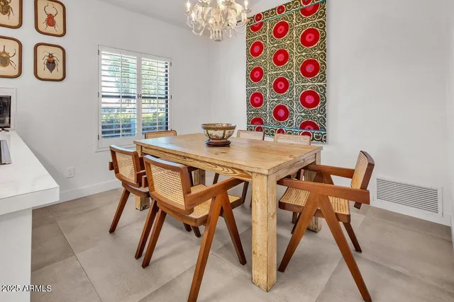 a view of a dining room with furniture and a window