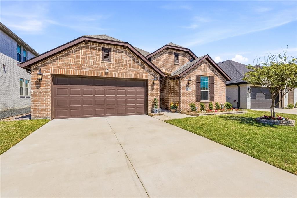 813 Mildren Lane Fate, TX 75087 - Photo 3 of 32 Additional view of front with decorative brick trim and beautiful shutters.