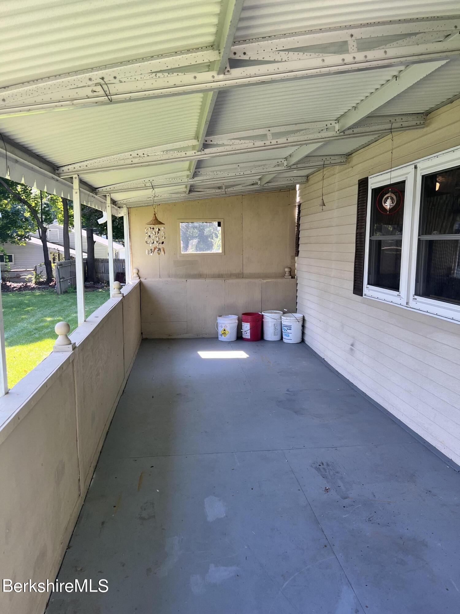 405 Pittsfield Road, Unit H12 Lenox, MA 01240 - Photo 11 of 13 a view of a storage area with a potted plant