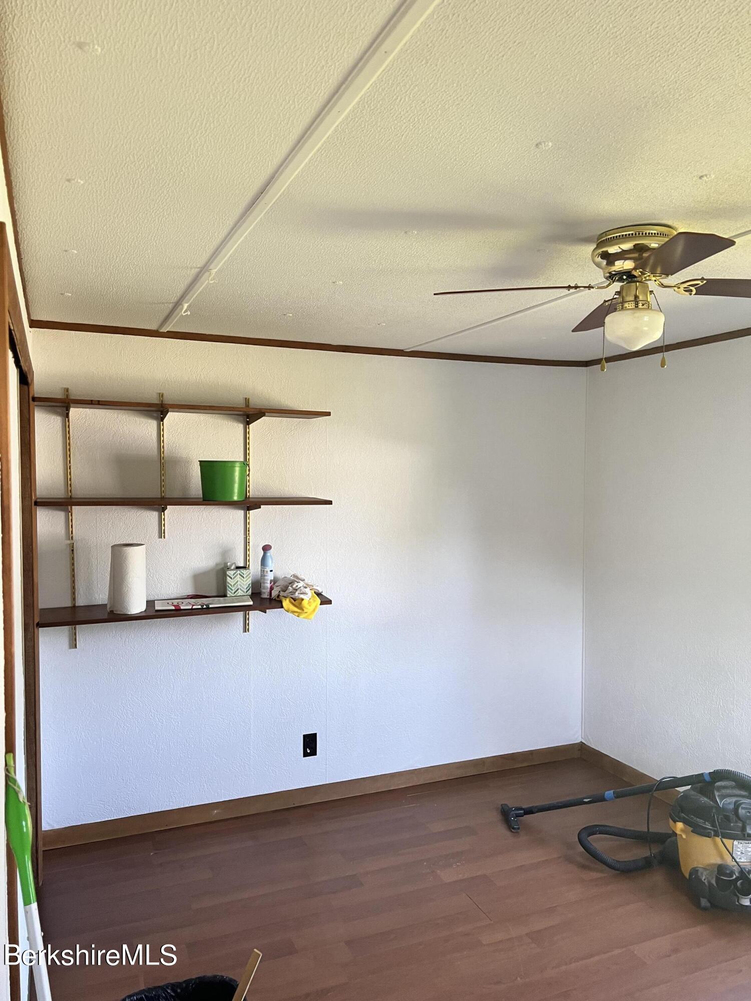 405 Pittsfield Road, Unit H12 Lenox, MA 01240 - Photo 5 of 13 a view of storage and utility room with washer and dryer