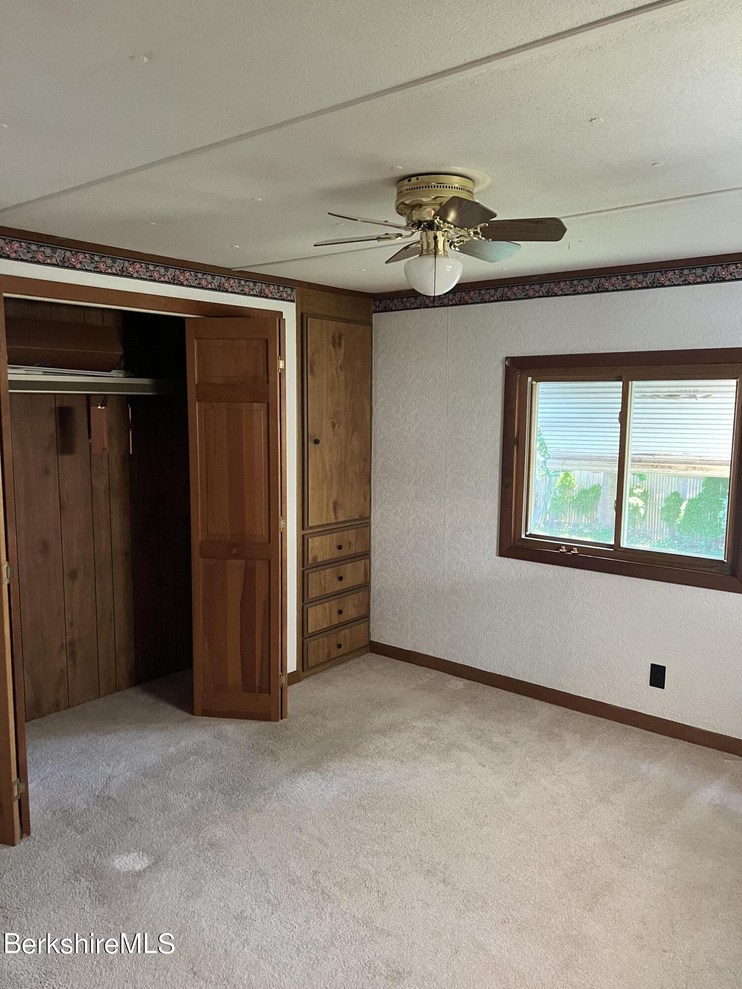 405 Pittsfield Road, Unit H12 Lenox, MA 01240 - Photo 6 of 13 an empty room with windows