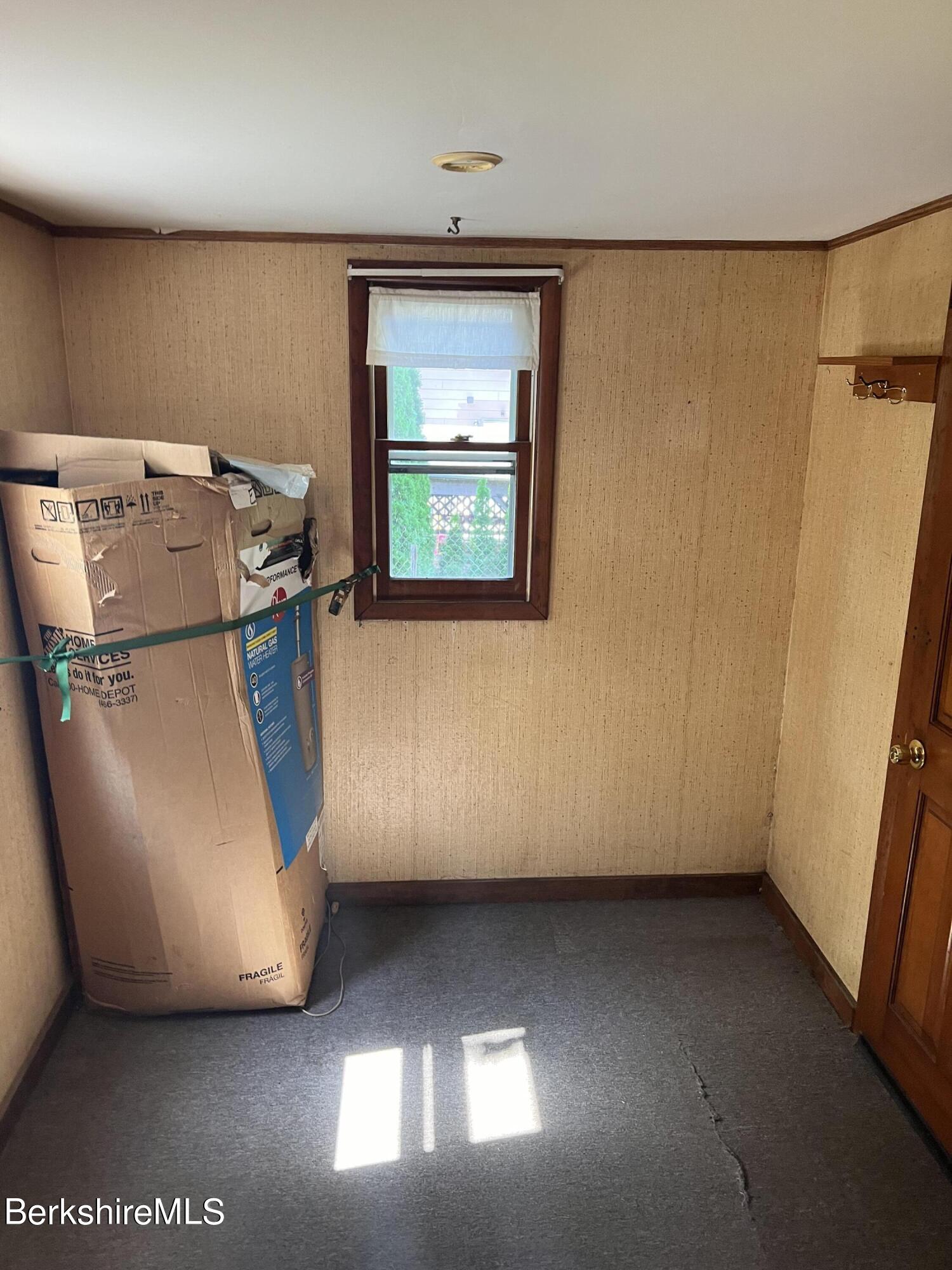 405 Pittsfield Road, Unit H12 Lenox, MA 01240 - Photo 7 of 13 a view of a storage & utility room with a window
