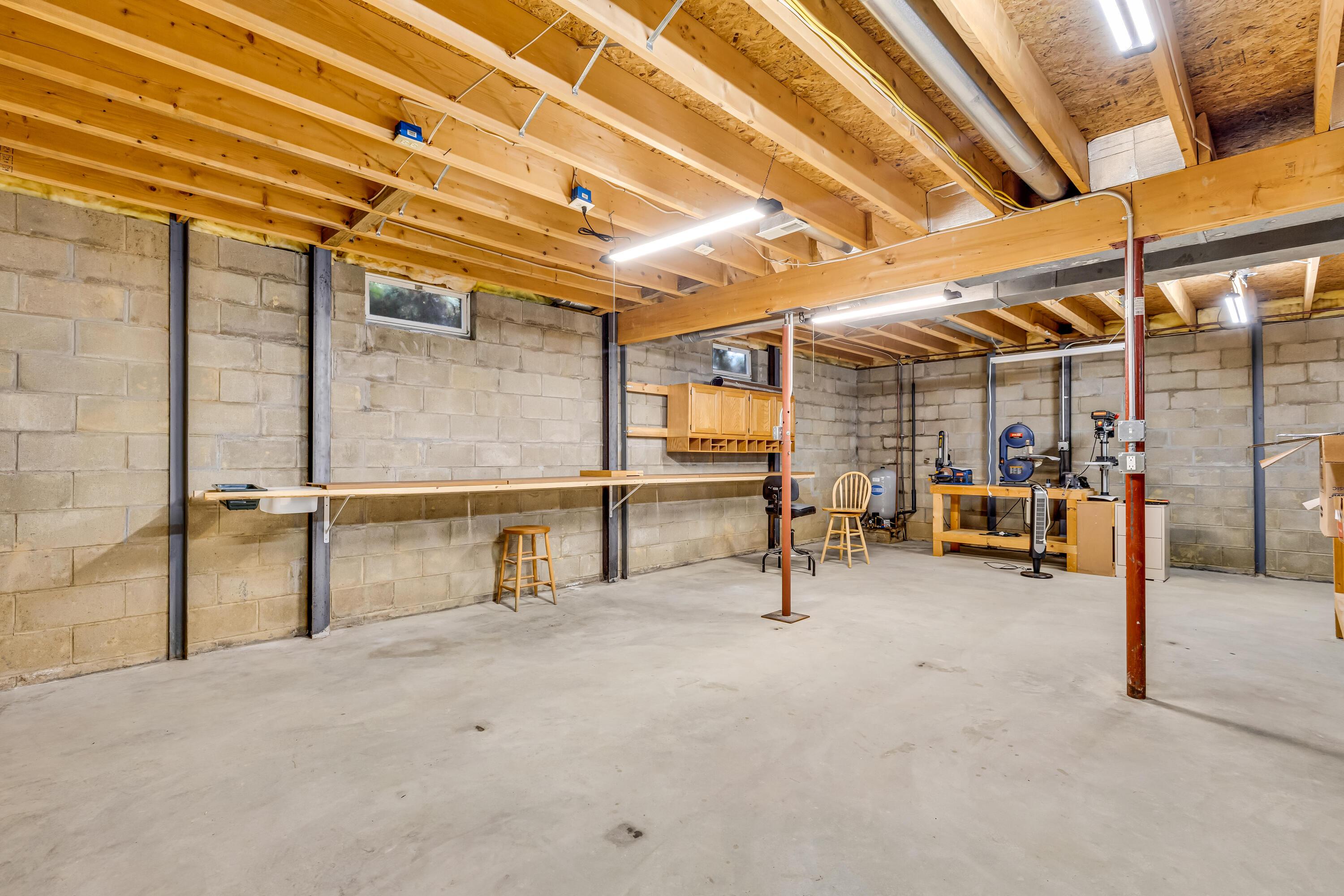 3753 Homer Road Northwest Utica, OH 43080 - Photo 47 of 87 • Full, unfinished • Concrete block foundation • Wall beams • Rough-in for generator • Sump pump • Fluorescent lighting • New pressure tank ~ 2025 • New Hempy® water conditioner (leased- $40/month) ~ 2025 • New Goodman® propane gas furnace ~ 2015 • Propane tank is leased through The Energy Group • Aprilaire® humidifier • Honeywell® air cleaner • Sepco® 120 gallon electric water heater, buyer to assume lease ($24/month) • Reverse osmosis system is owned • Storage under stairs • Wood shelves and tools remain • Washer & dryer remain