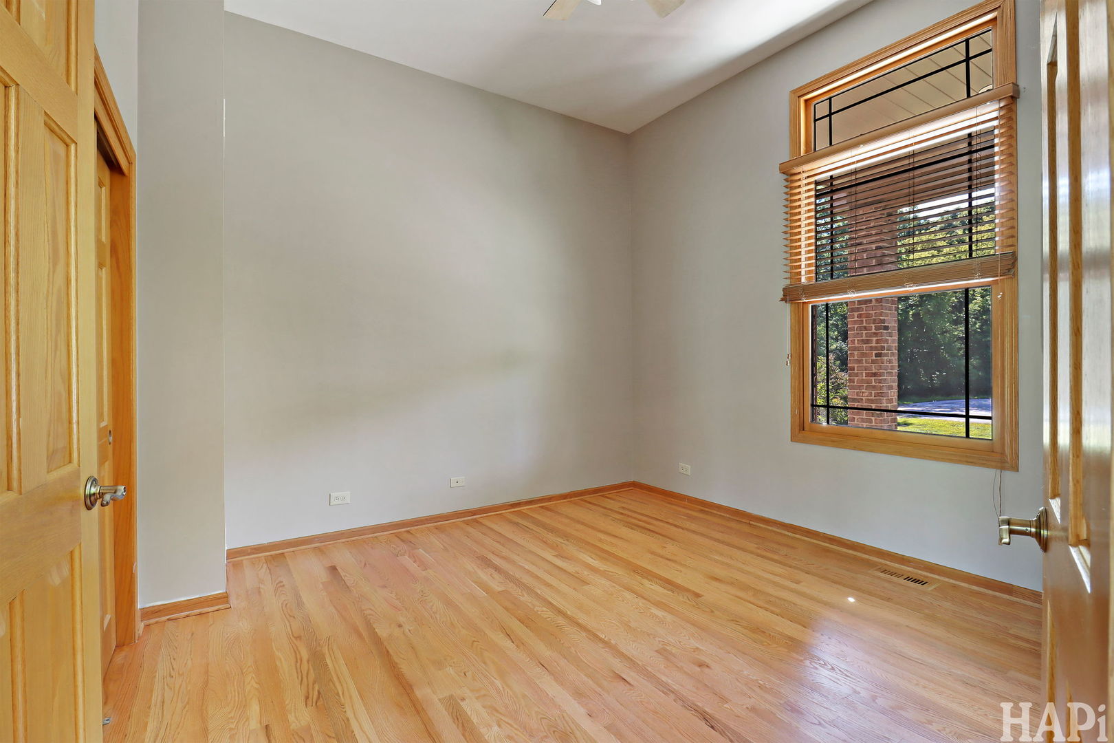 9014 Glacier Ridge Richmond, IL 60071 - Photo 11 of 48 a view of an empty room with wooden floor and a window