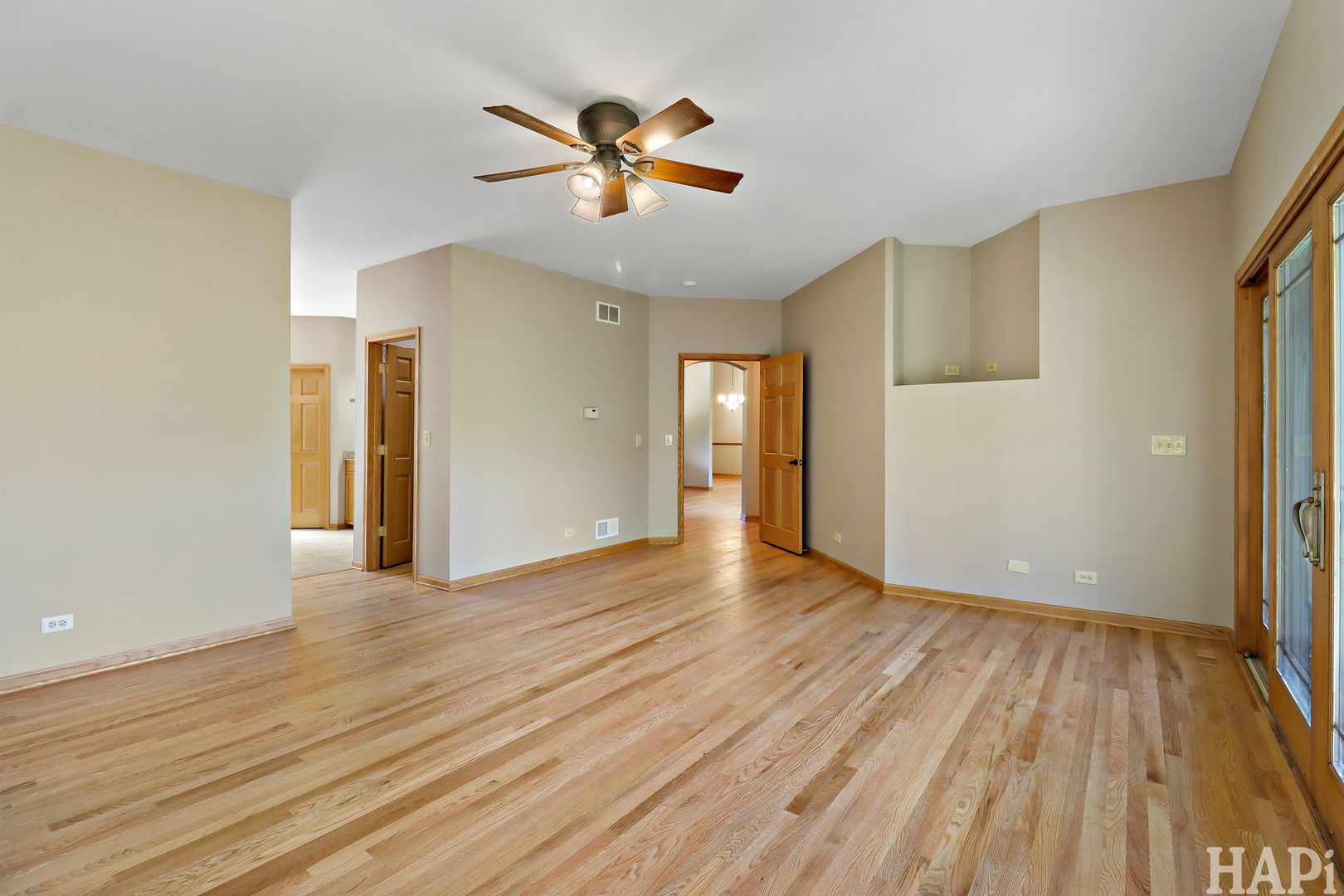 9014 Glacier Ridge Richmond, IL 60071 - Photo 25 of 48 a view of empty room with wooden floor and fan