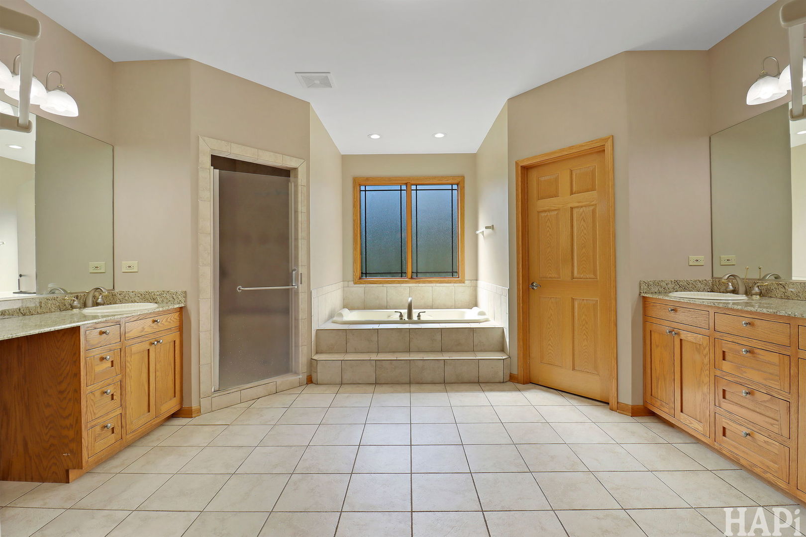 9014 Glacier Ridge Richmond, IL 60071 - Photo 28 of 48 a bathroom with a granite countertop sink mirror and bathtub