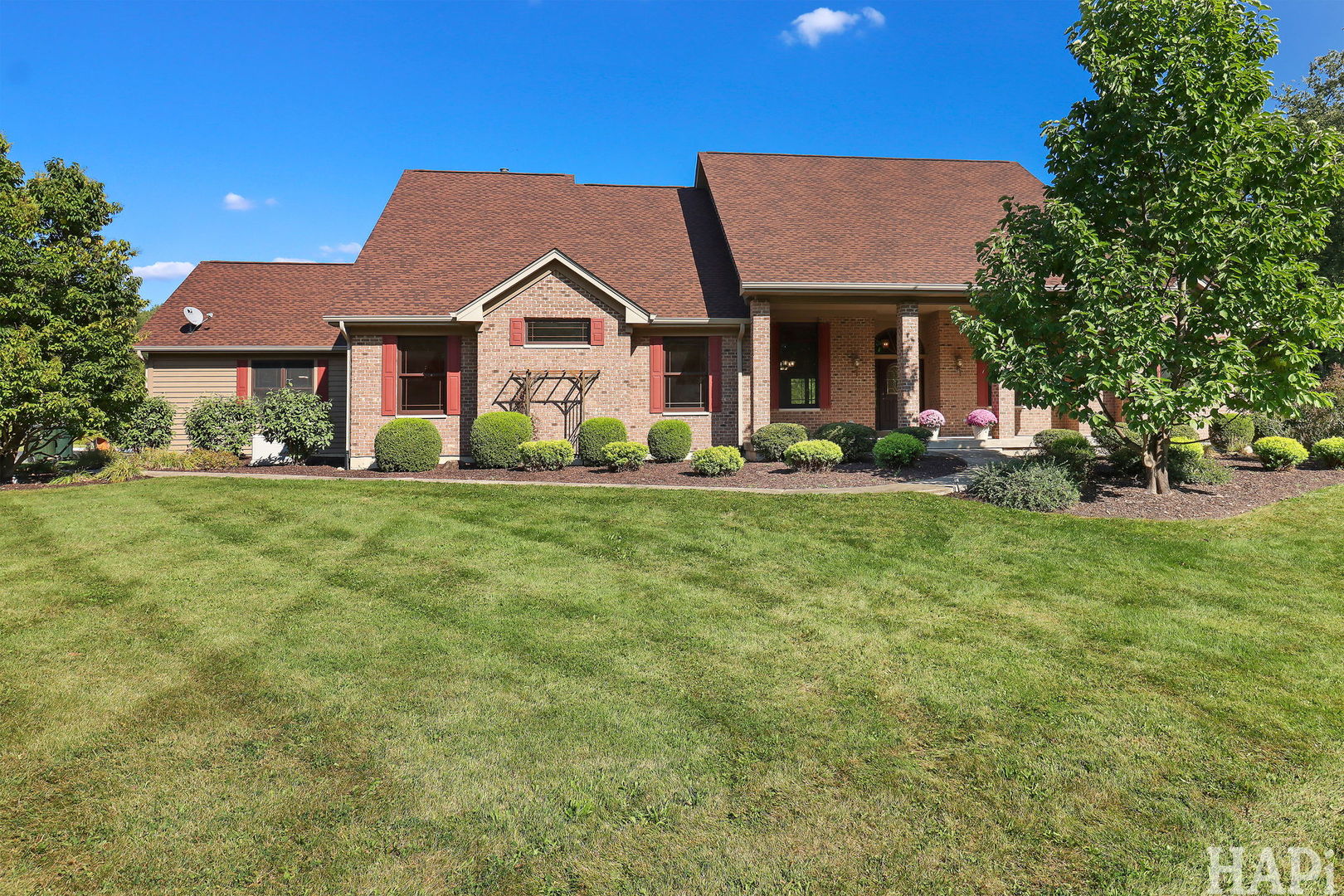9014 Glacier Ridge Richmond, IL 60071 - Photo 3 of 48 a front view of a house with a yard porch and outdoor seating