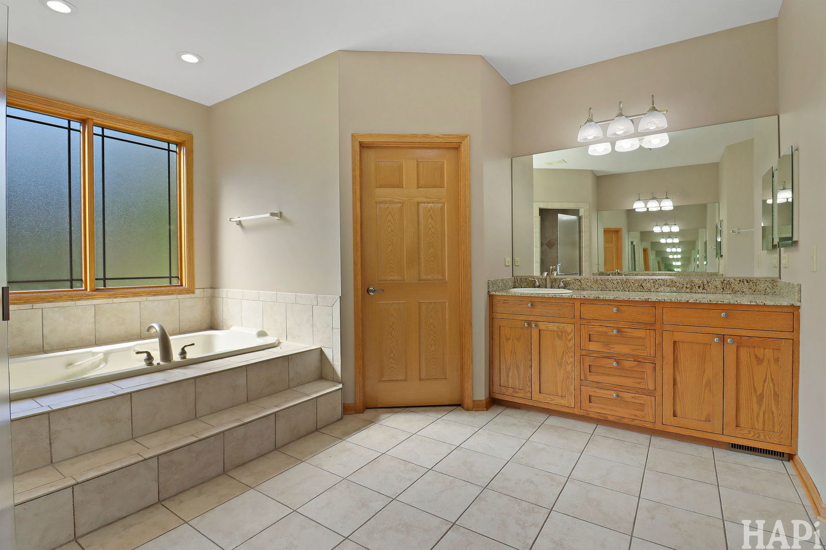 9014 Glacier Ridge Richmond, IL 60071 - Photo 31 of 48 a spacious bathroom with a double vanity sink mirror and a