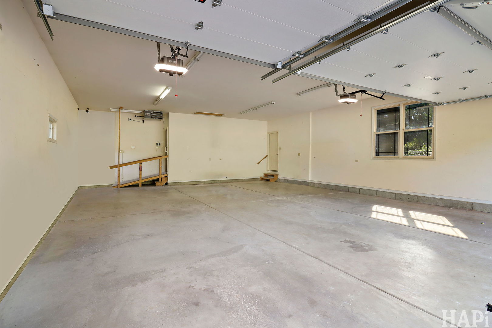 9014 Glacier Ridge Richmond, IL 60071 - Photo 48 of 48 an empty room with a ceiling fan and windows