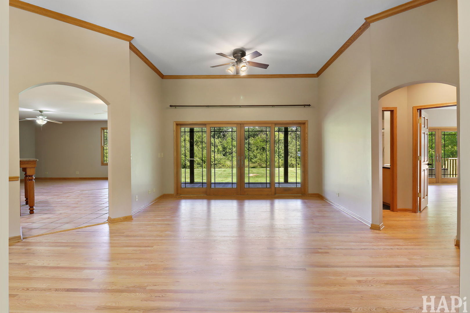 9014 Glacier Ridge Richmond, IL 60071 - Photo 6 of 48 a view of a hallway with wooden floor and a chandelier
