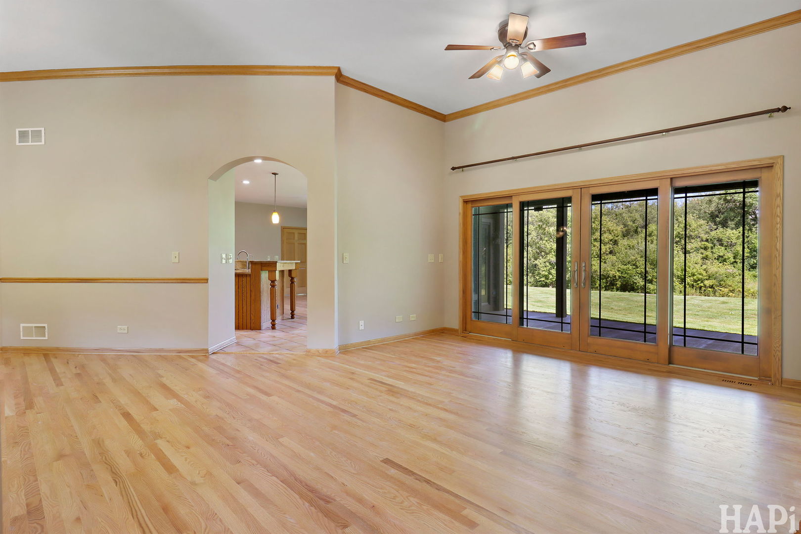 9014 Glacier Ridge Richmond, IL 60071 - Photo 8 of 48 a view of empty room with wooden floor and fan