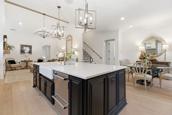 a kitchen with center island table and chairs in it