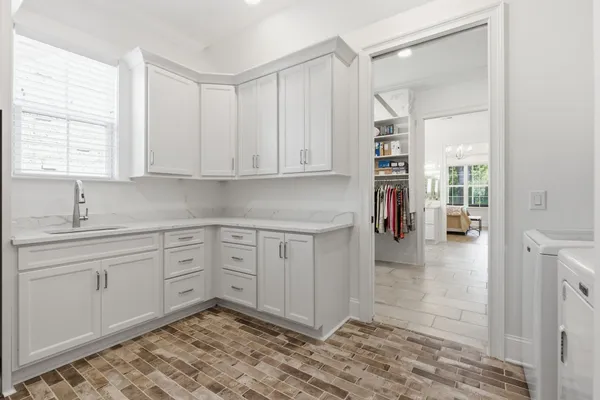 a kitchen with a sink and cabinets