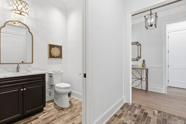a bathroom with a sink toilet and vanity