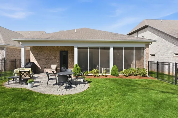 a front view of house with yard and outdoor seating