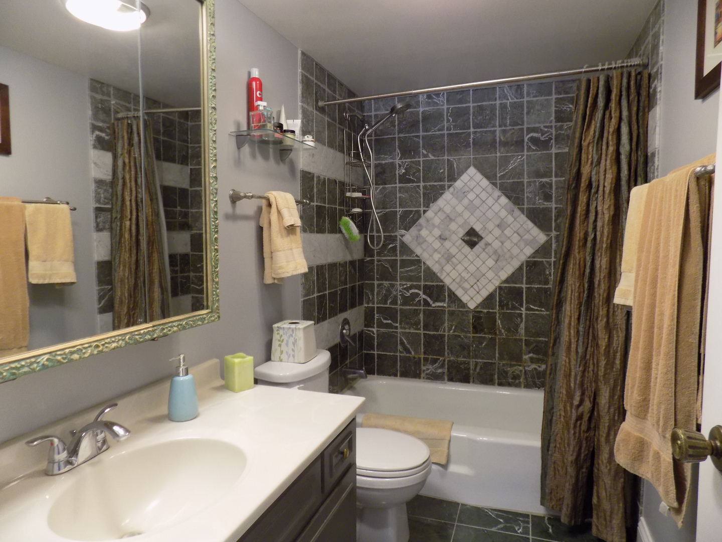 1025 South Fernandez Avenue, Unit 3M Arlington Heights, IL 60005 - Photo 15 of 20 a bathroom with a sink toilet and shower