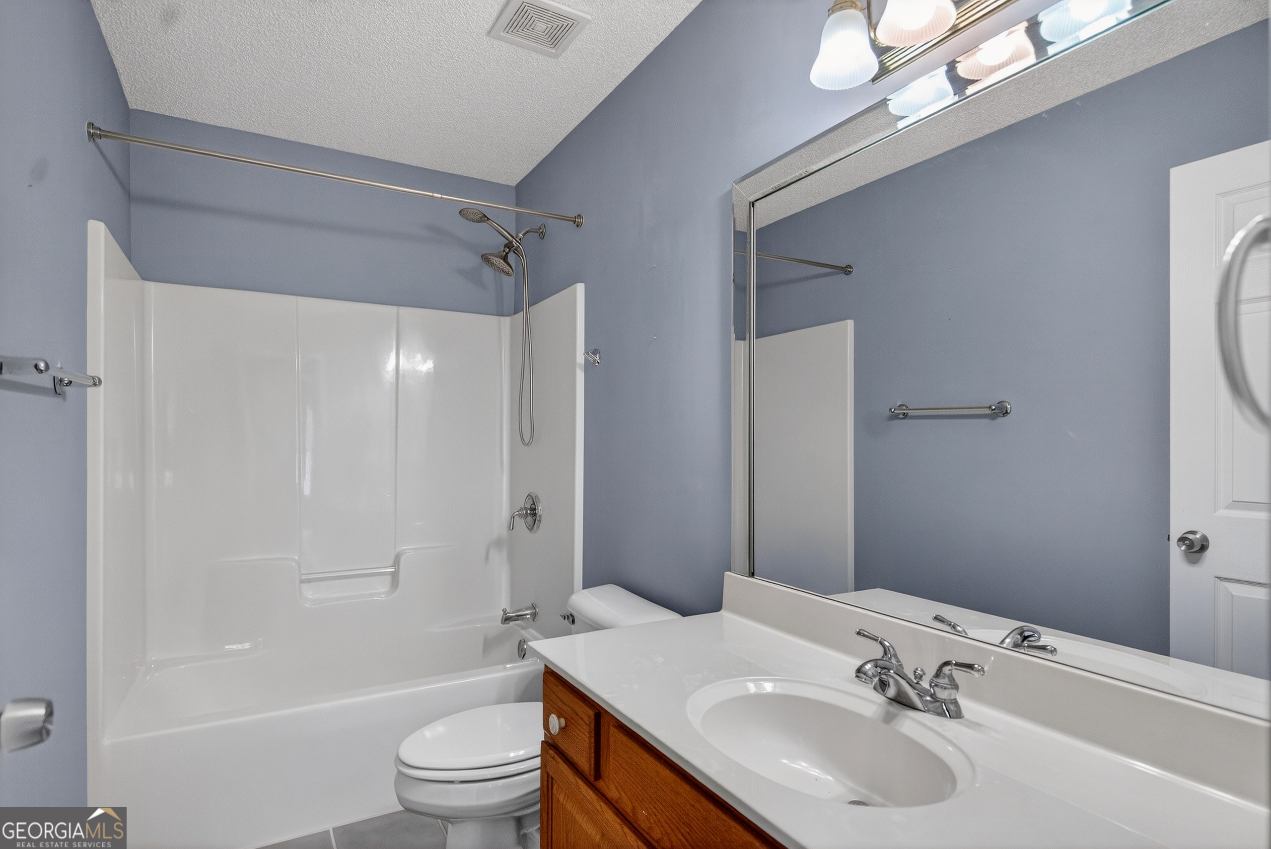 107 Waters Edge Drive LaGrange, GA 30240 - Photo 19 of 29 a bathroom with a sink a toilet and shower