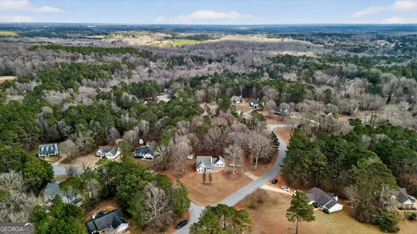 an aerial view of a houses with outdoor space