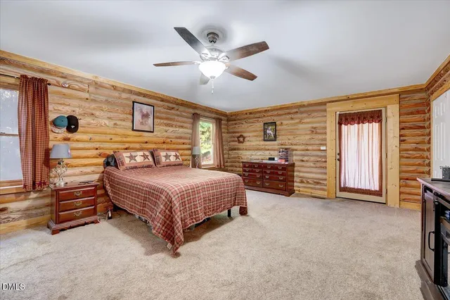 a bathroom with a sink a toilet and shower curtain