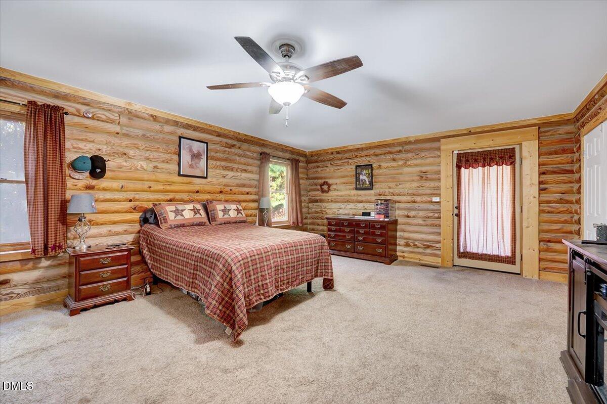 8545 Grassy Creek Road Oxford, NC 27565 - Photo 19 of 39 a spacious bedroom with a bed and dresser