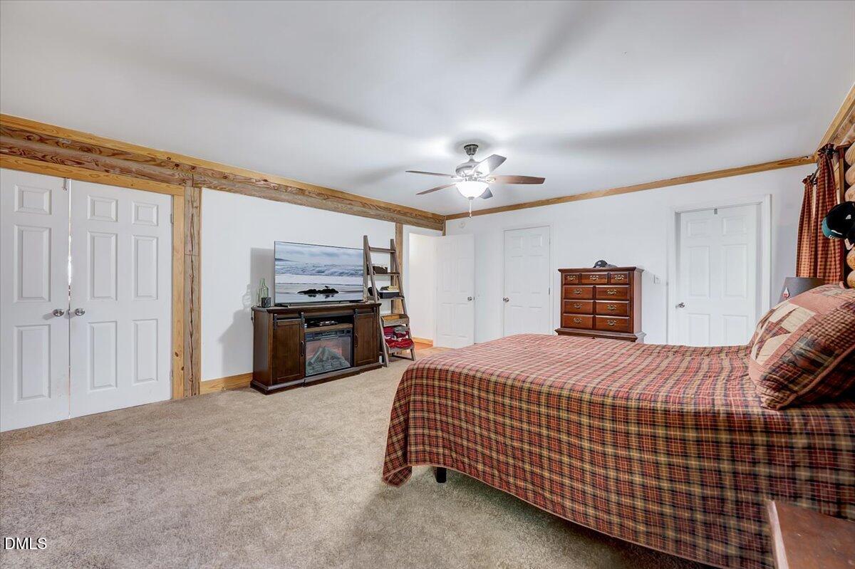 8545 Grassy Creek Road Oxford, NC 27565 - Photo 21 of 39 a bedroom with a bed and a television
